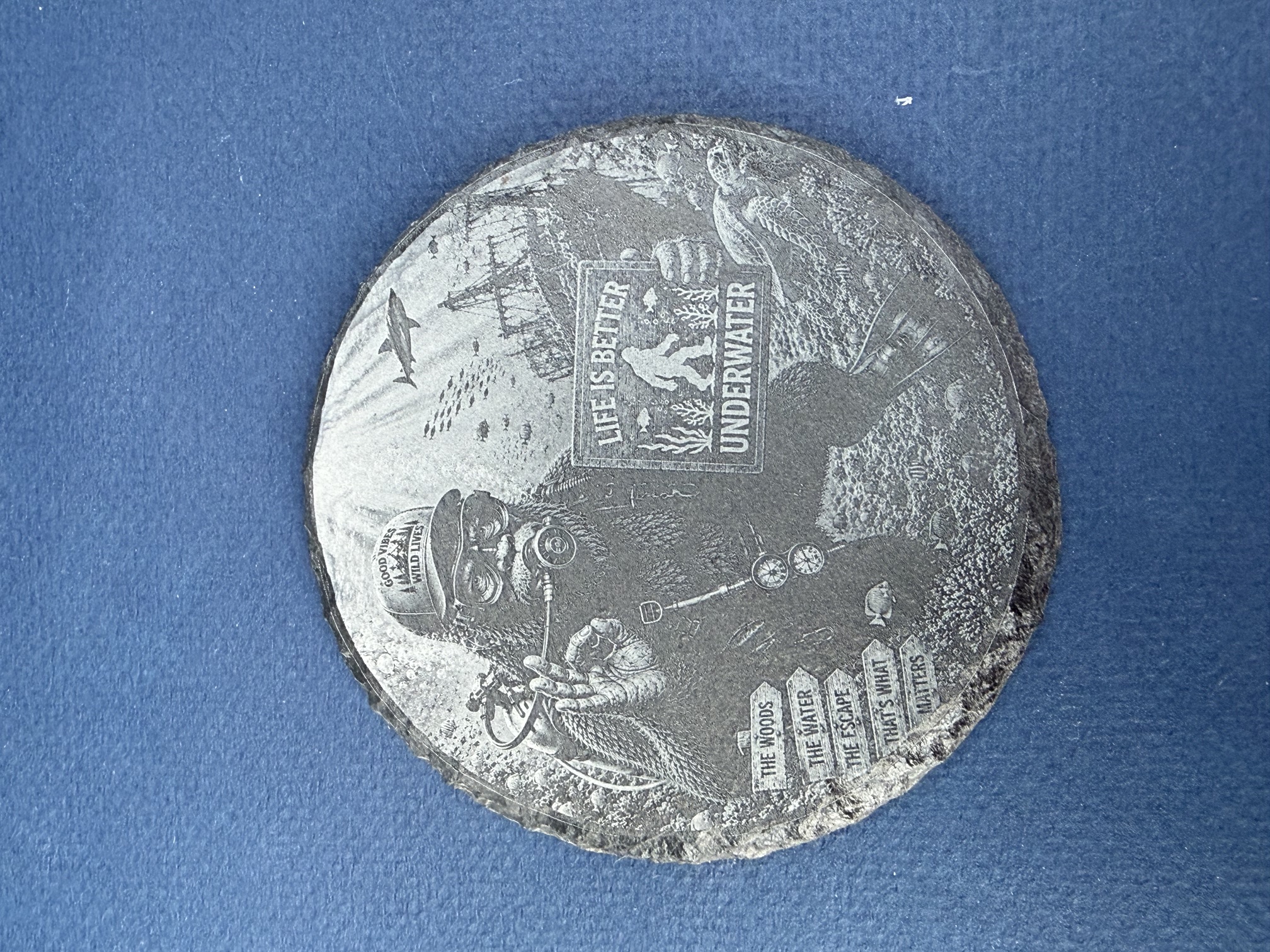 [Laser cut and engrave] Round Slate Coaster Featuring Scuba Diving Bigfoot Underwater Scene