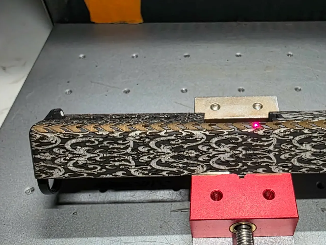 [Laser cut and engrave] Pistol slide with intricate filigree and chevron pattern