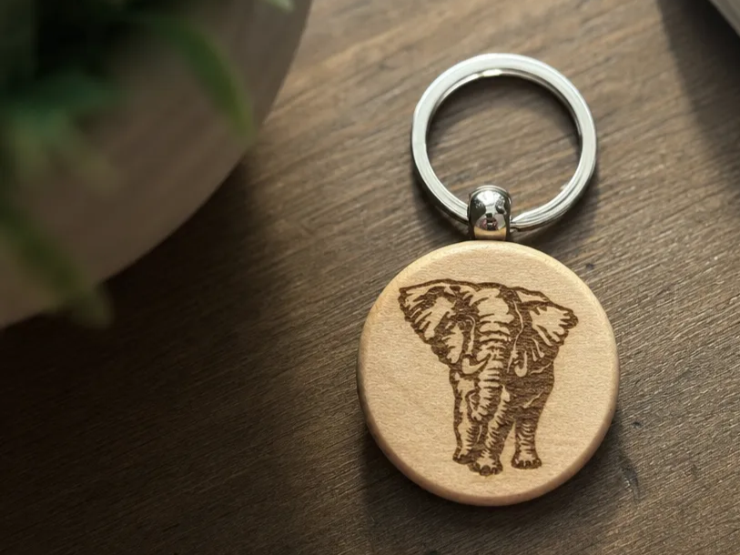 Round Wooden Keychain Featuring an Elephant Illustration