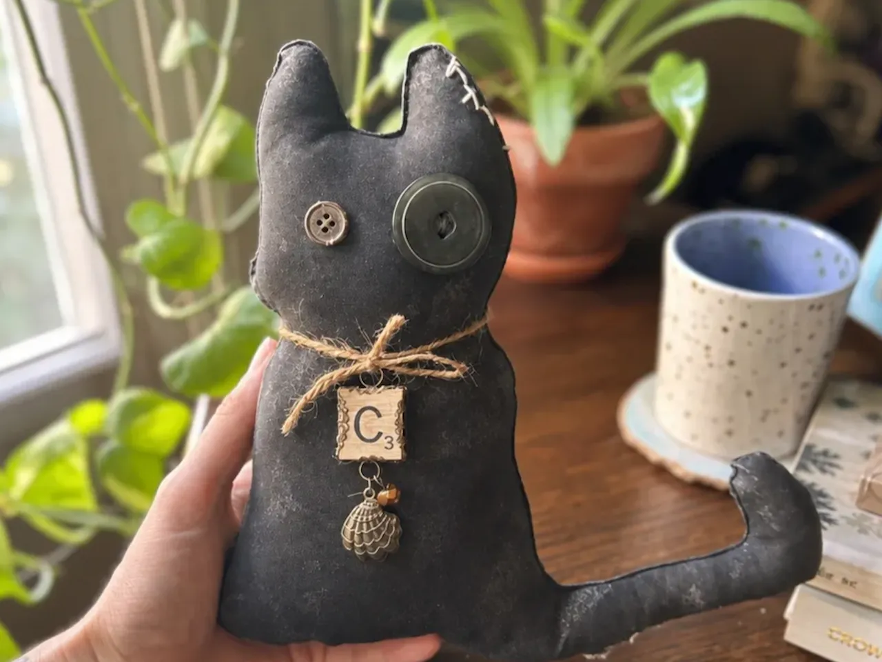 [Laser cut and engrave] Black fabric cat plush with button eyes and letter charm
