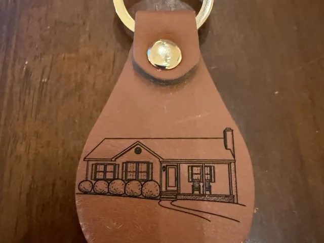 Leather keychain with picture of a house