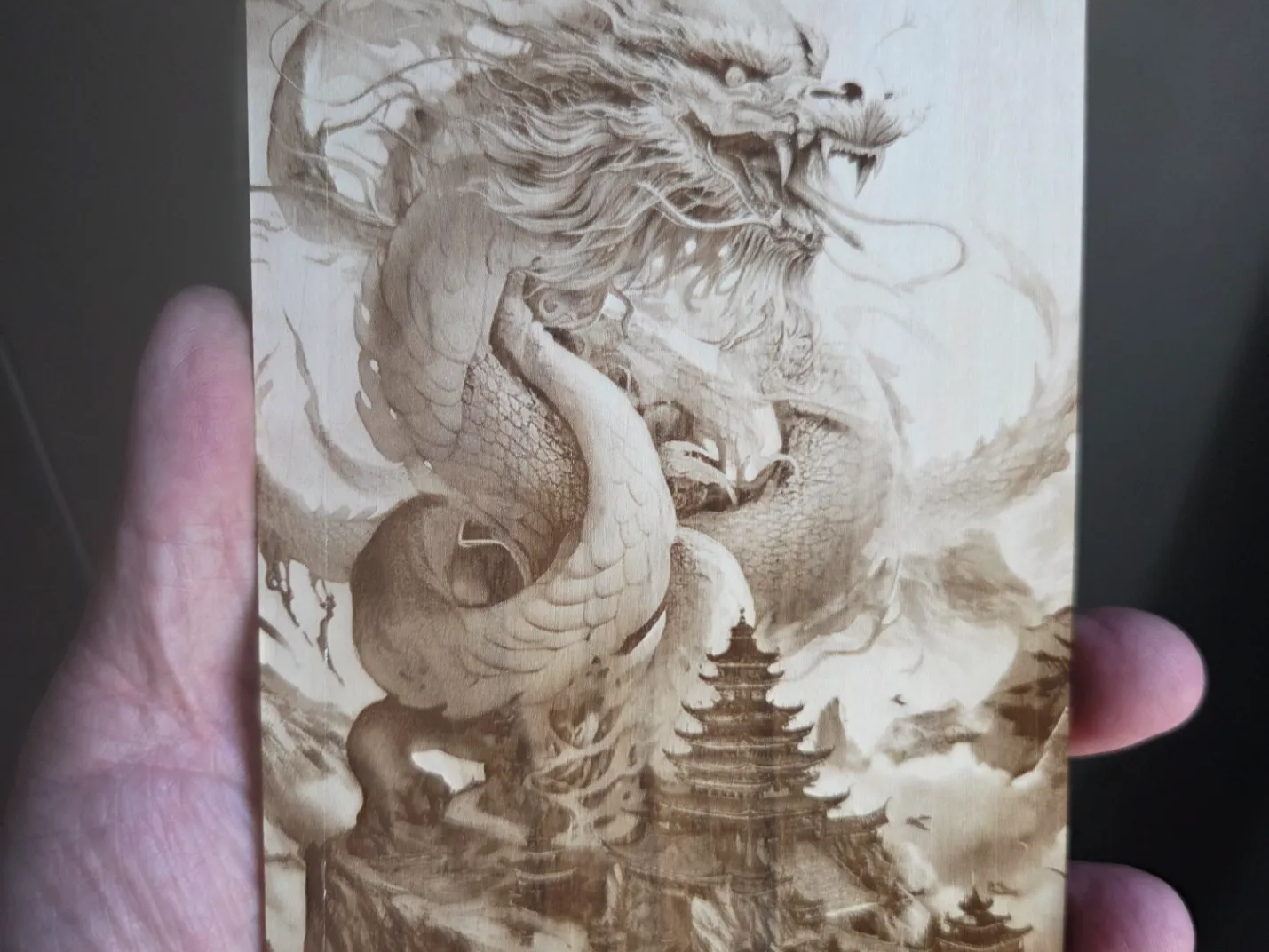 Detailed wood art featuring a majestic dragon and traditional pagoda temple