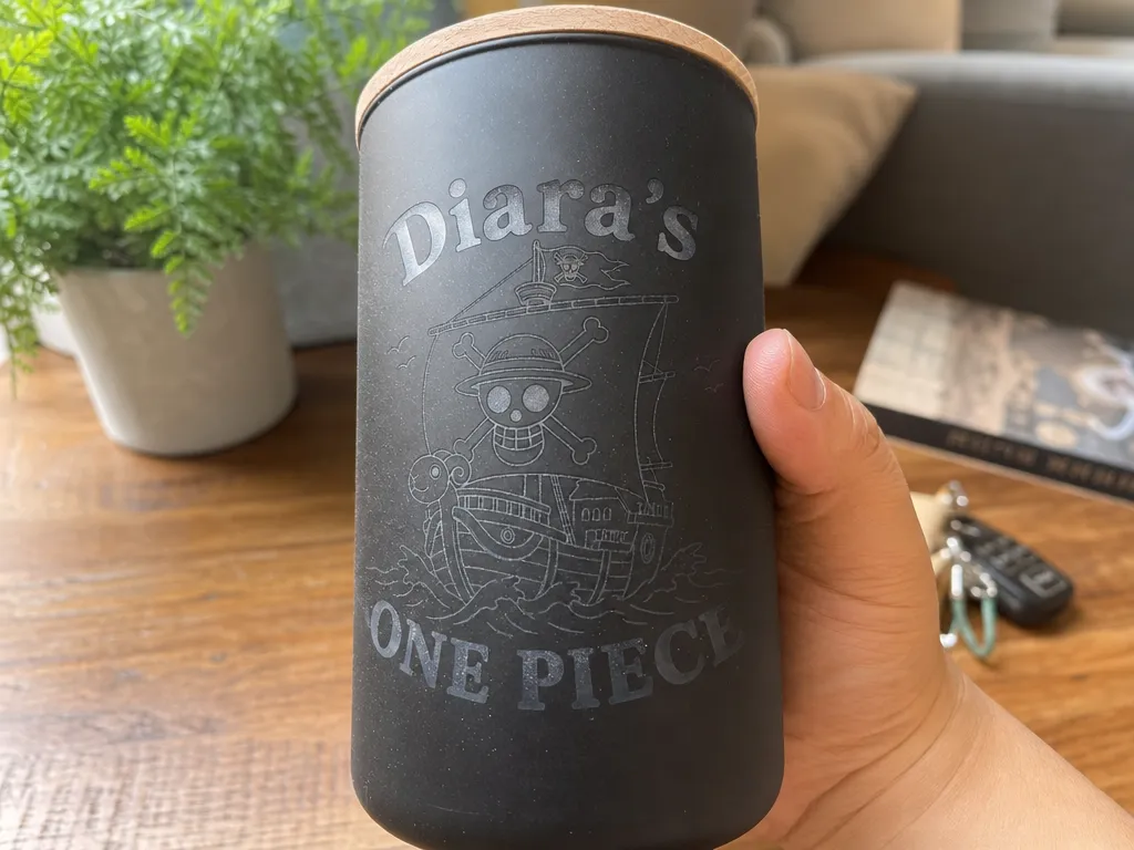 Black insulated tumbler engraved with One Piece ship design and custom name gift idea