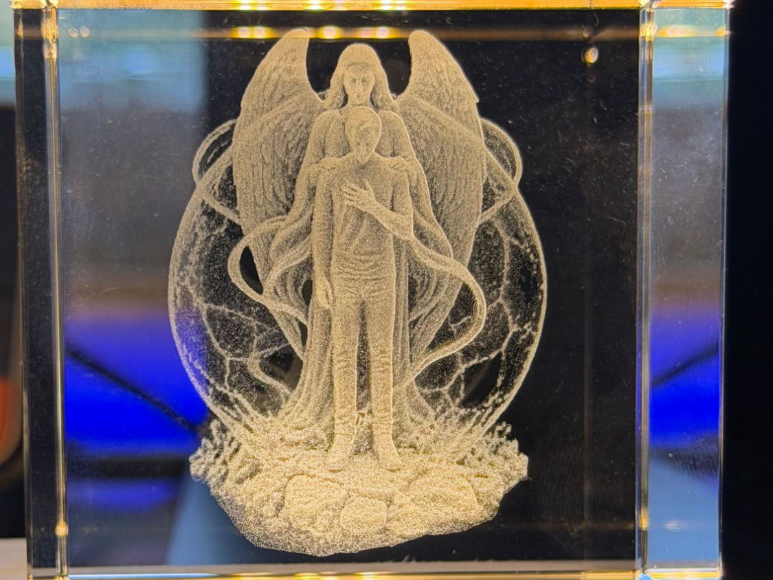 Crystal block featuring a guardian angel protecting a person