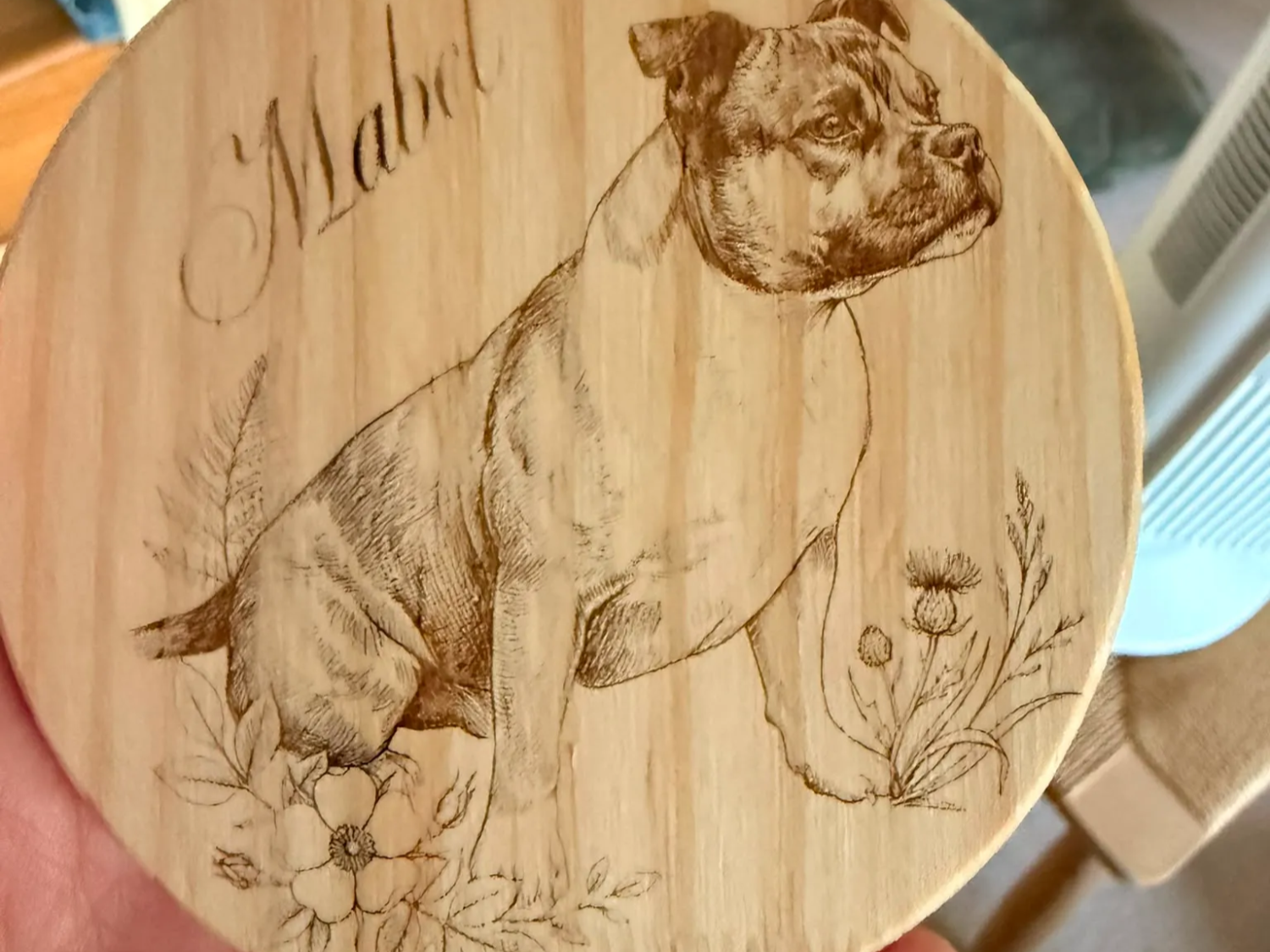 Pine coaster, engraved with my families dog.