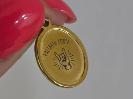 Oval Gold Pendant with Rock and Roll Hand Gesture