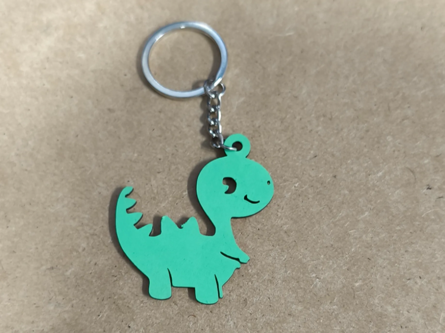 Llavero de dinosaurio verde para niños