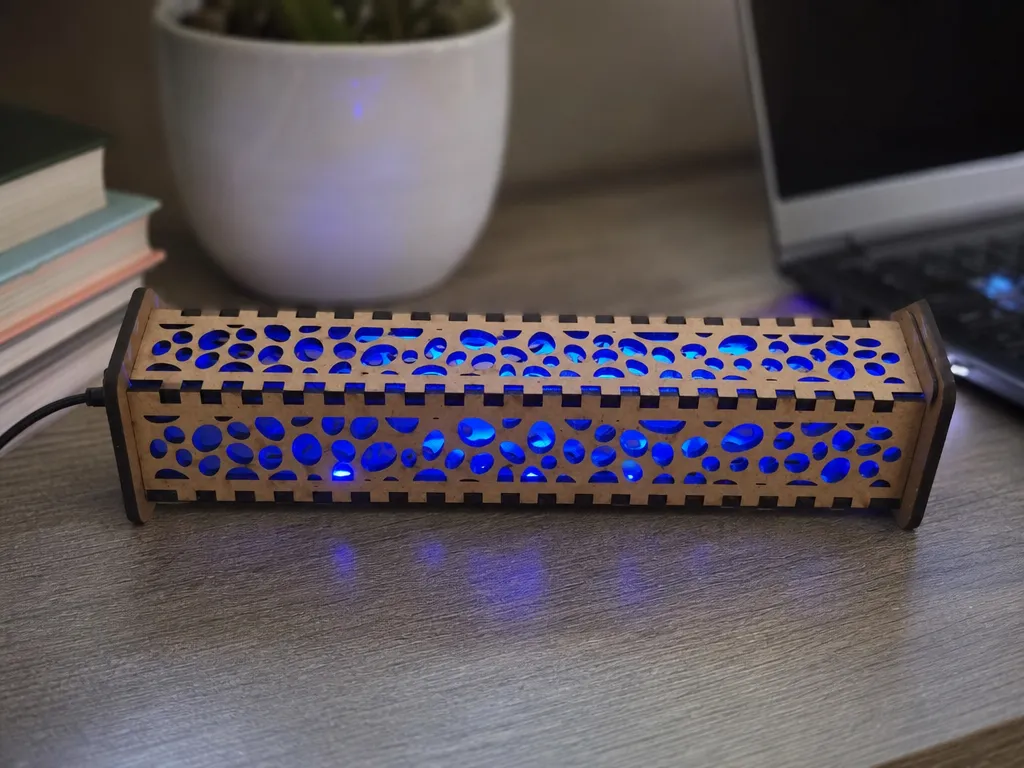Rectangular wooden desk lamp with blue LED light and organic cutout pattern