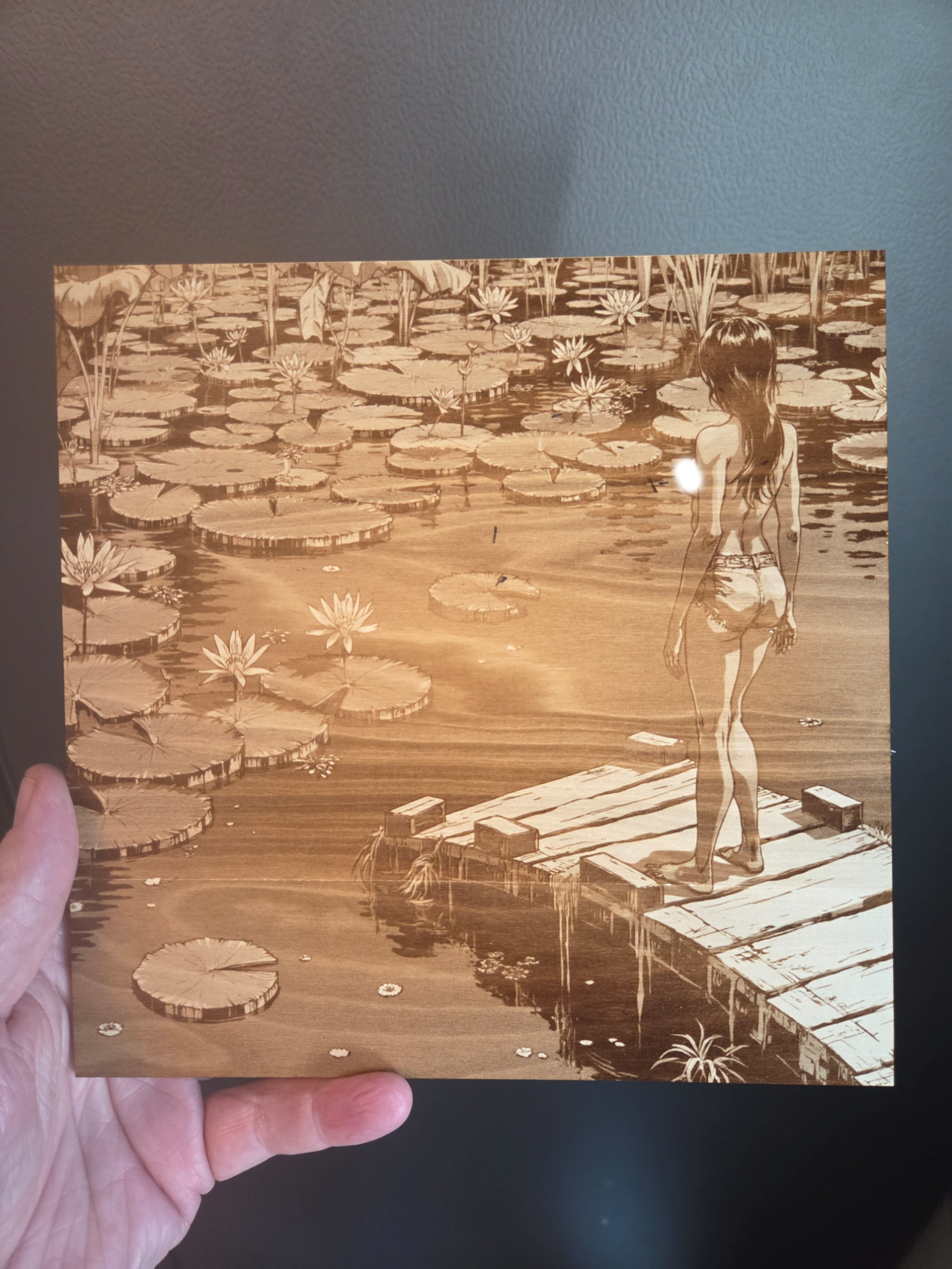 Wooden wall art featuring a woman standing on a dock in a lily pond instruction: step 1 - 