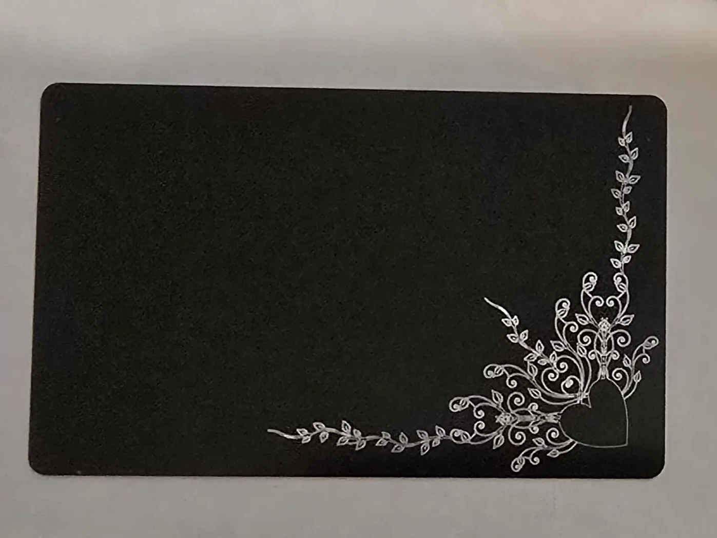 Black rectangular card with silver heart and vine corner motif