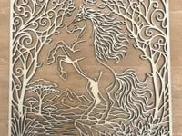 [Laser cut and engrave] Intricate Paper Cutout Art Featuring a Rearing Horse in a Forest Landscape
