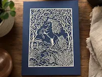 [Laser cut and engrave] Intricate Paper Cutout Art Featuring a Rearing Horse in a Forest Landscape