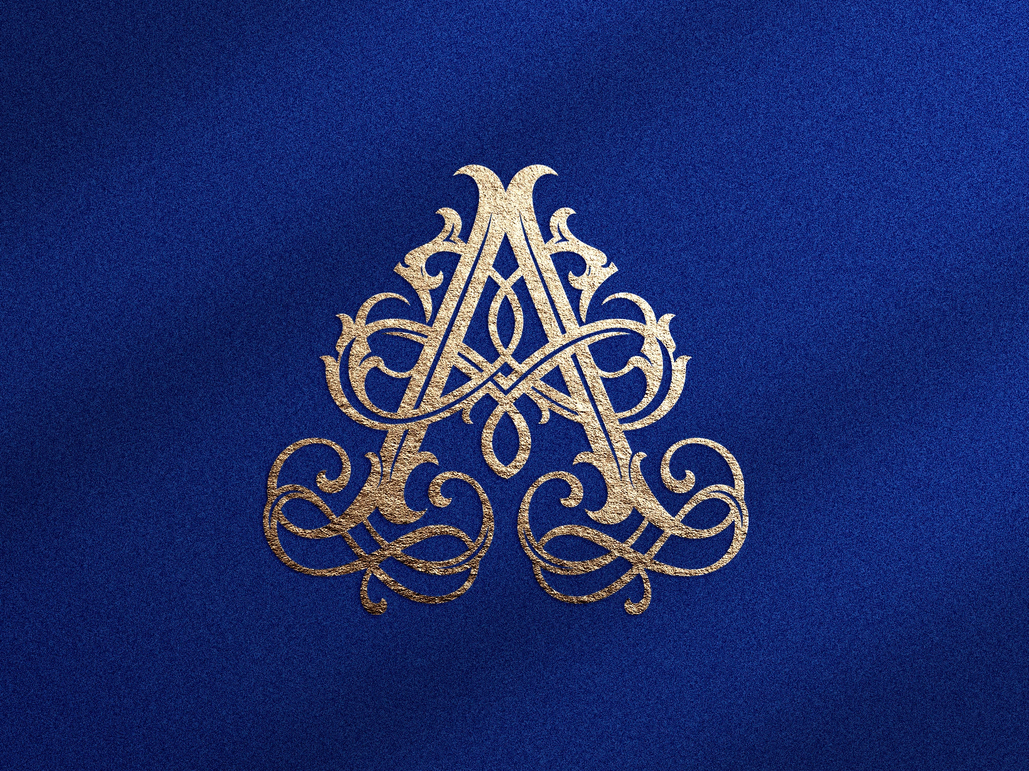 Monogramme lettre A doré ornemental sur fond bleu texturé