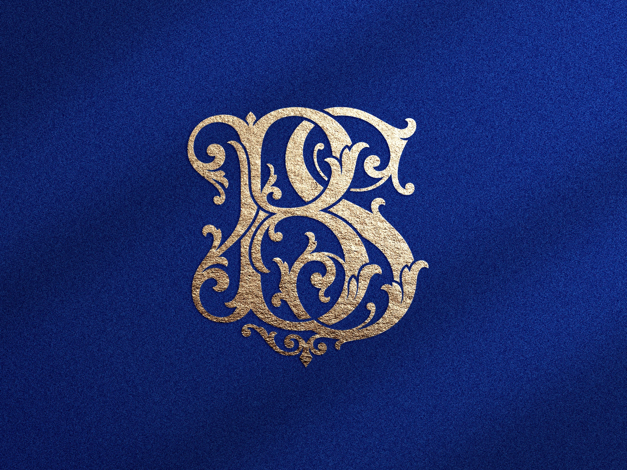 Monogramme doré de la lettres BS sur fond bleu texturé