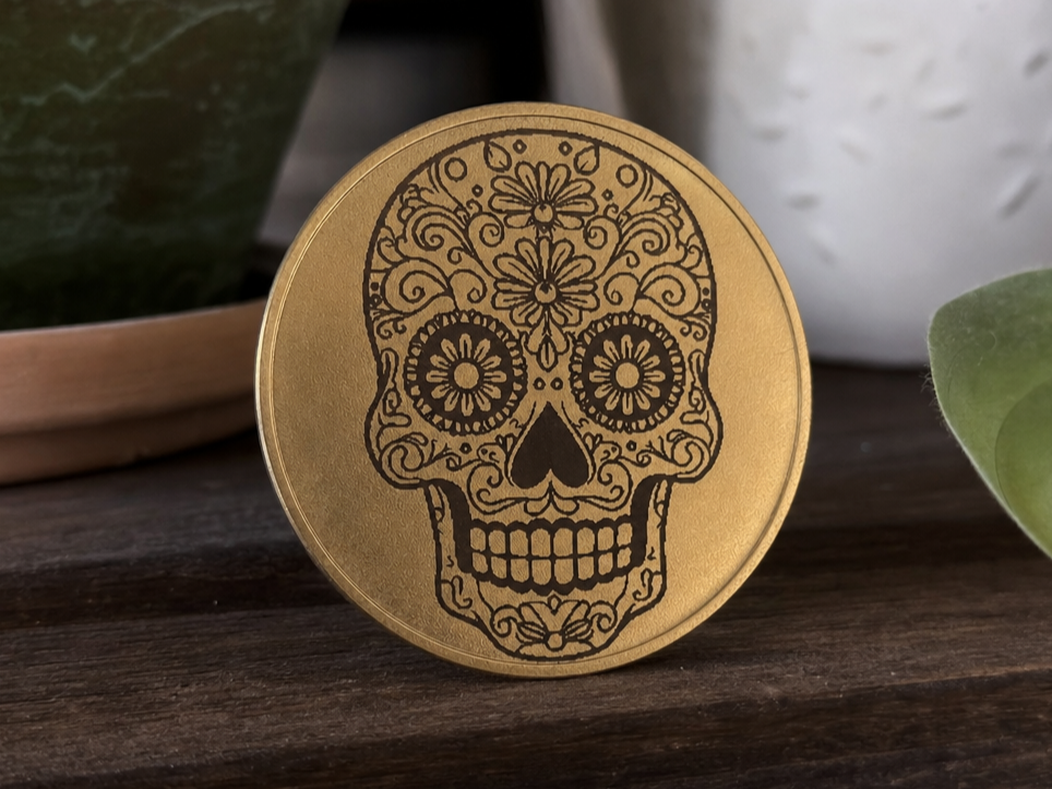 Calavera on a gold coin
