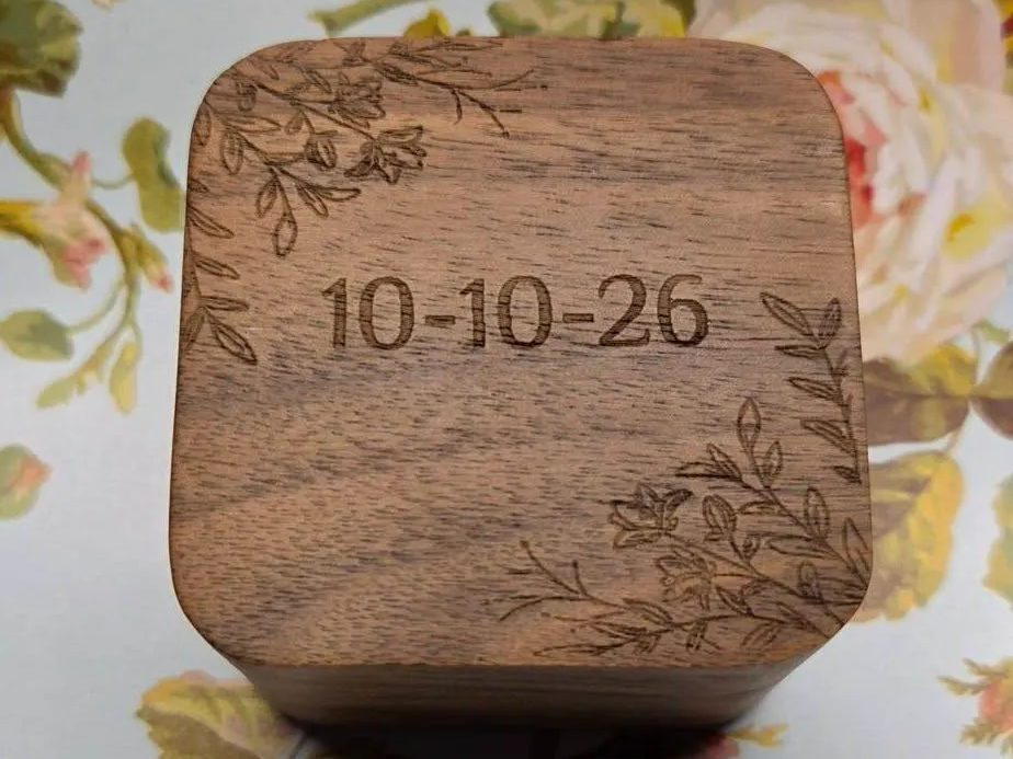 Wooden ring box with floral corner accents and date engraving