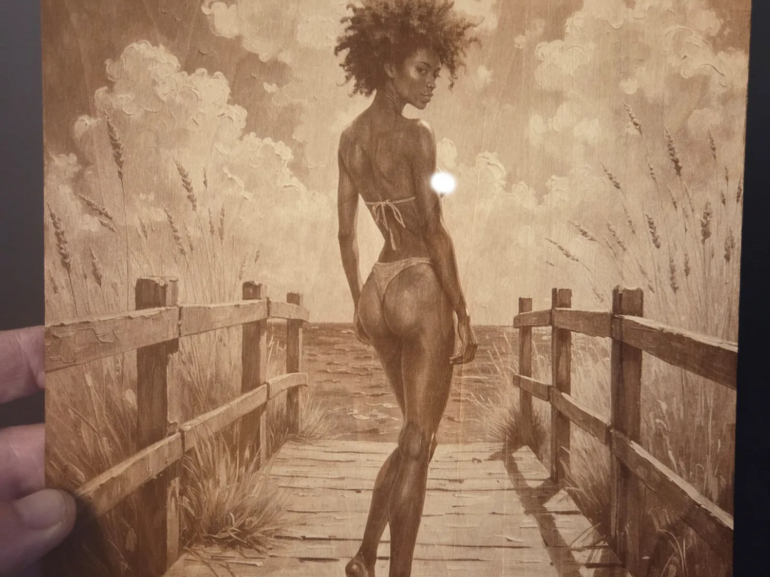Wooden wall art featuring a woman on a beach boardwalk
