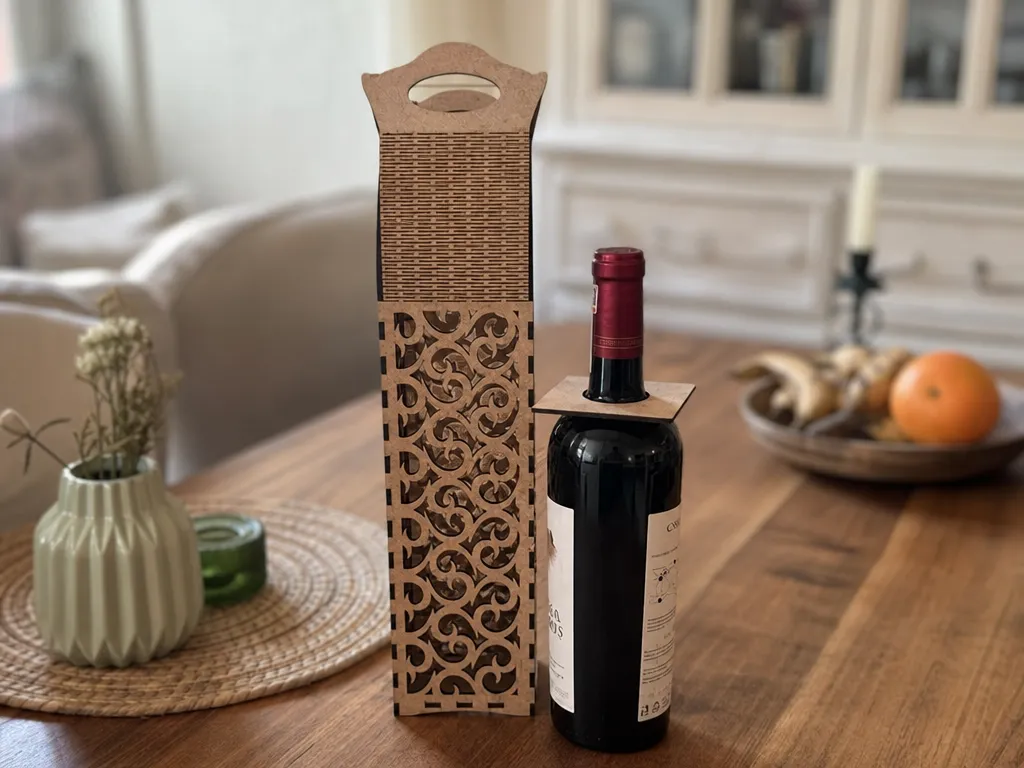 Decorative wooden wine bottle carrier with intricate scrollwork pattern