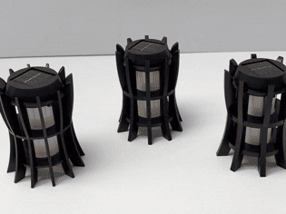 Three black slatted solar powered laser cut tabletop lanterns outdoor light idea