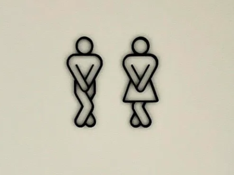 Restroom Sign with Male and Female Figures Crossing Legs