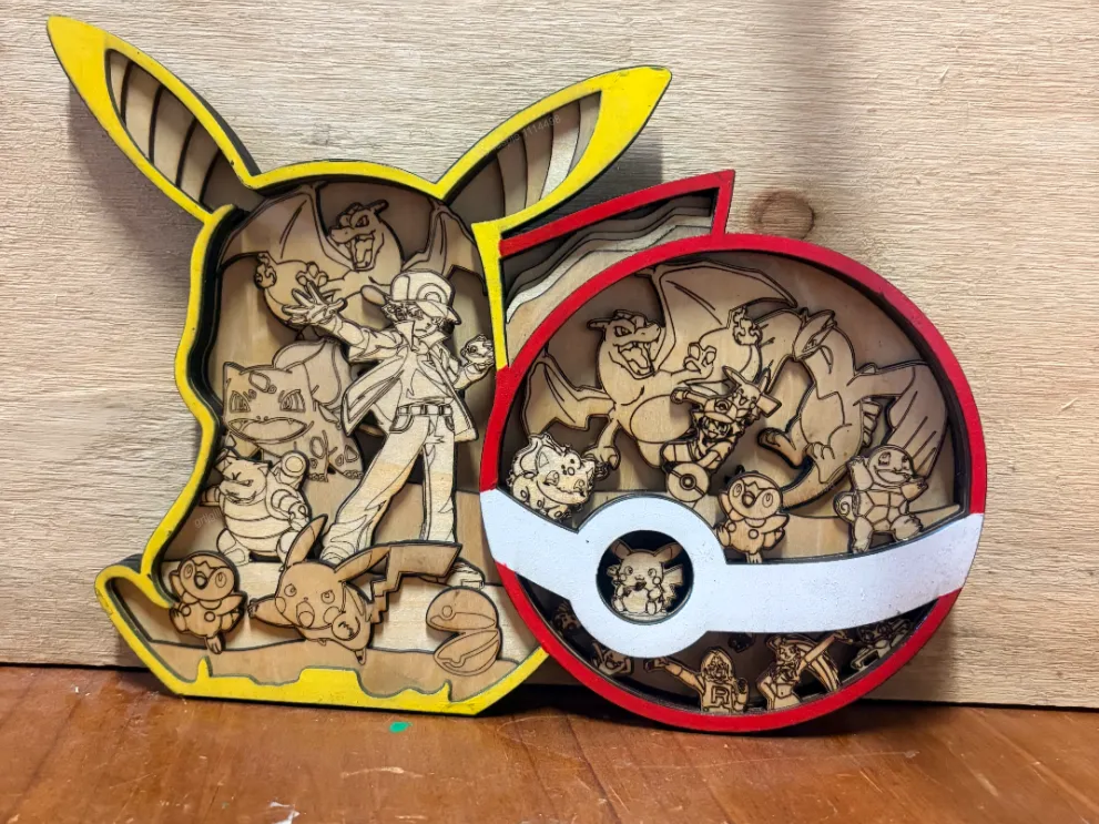 Pikachu and Pokeball layered wooden wall art featuring various Pokemon characters
