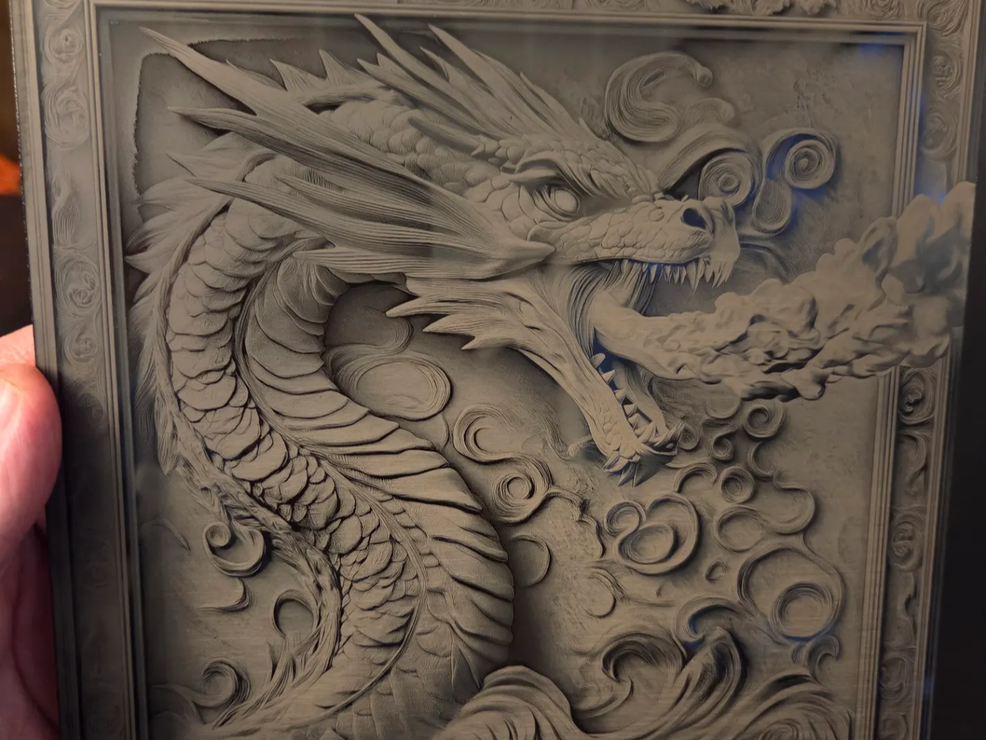 Intricate Dragon Relief Wall Art with Swirling Clouds