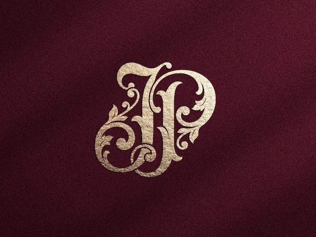 Monogramme doré orné avec les lettres J et P sur fond bordeaux