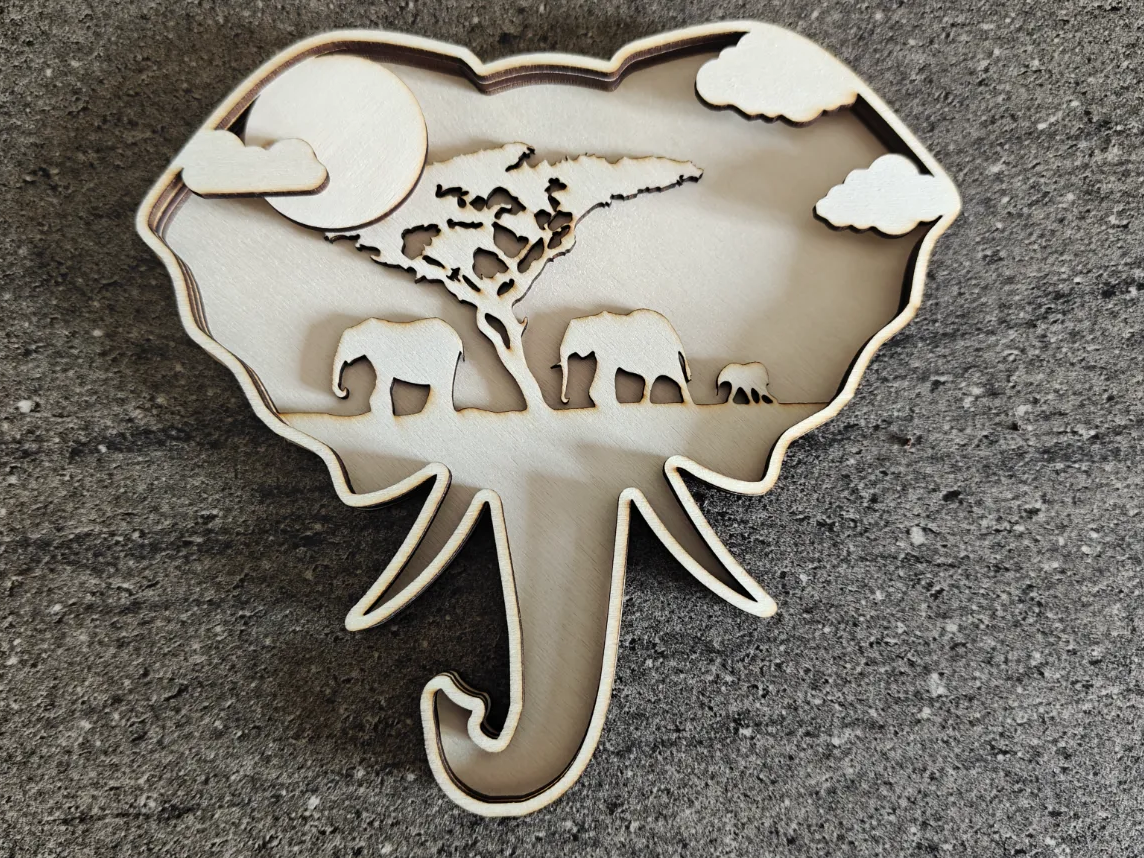 Décoration murale en forme de tête d'éléphant avec paysage de savane