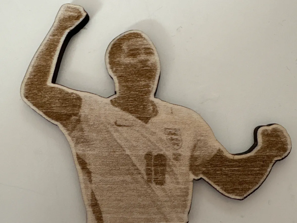 [Laser cut and engrave] Wooden Silhouette of a Soccer Player Celebrating a Goal