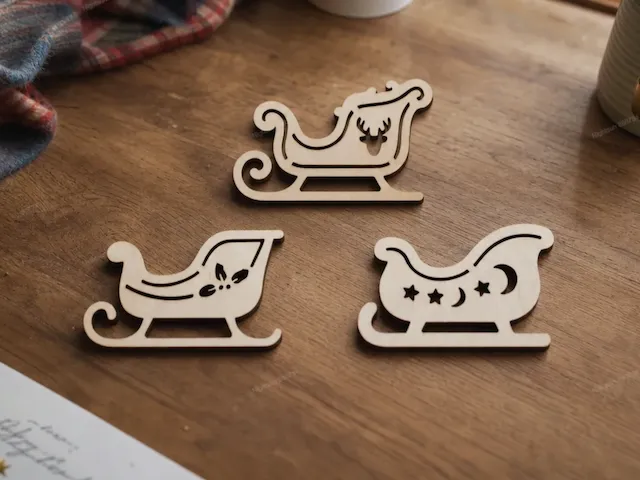 Wooden Christmas Sleigh Ornaments with Reindeer, Star, and Moon Motifs