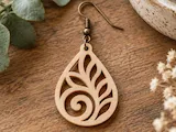[Laser cut and engrave] Teardrop shaped wooden earring with intricate leaf cutout pattern