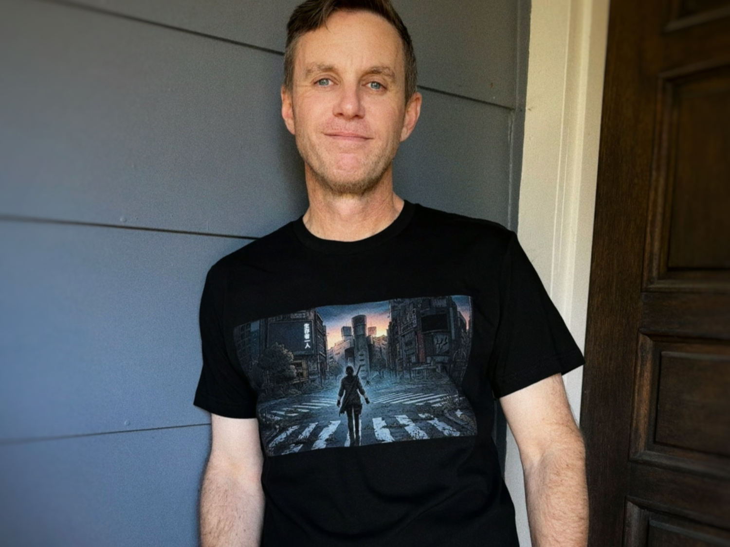 Black T-shirt featuring post-apocalyptic city landscape with lone survivor