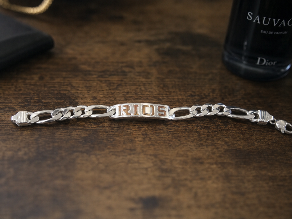 a gold name on a white gold bracelet
