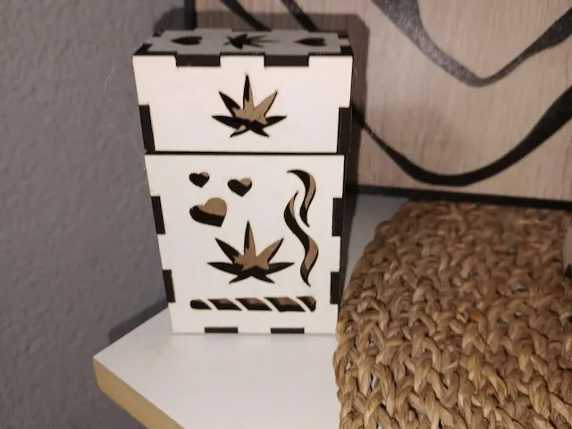 Small wooden stash box with cannabis leaf and heart cutouts