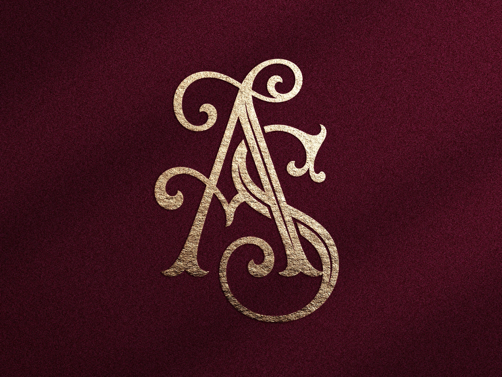 Monogramme doré avec lettres entrelacées A et S sur fond texturé bordeaux