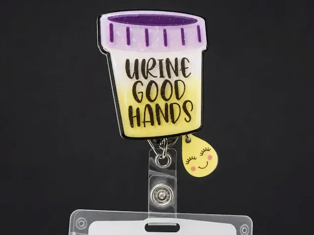 Urine good hands cup badge reel