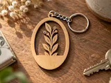 [Laser cut and engrave] Oval wooden keychain with botanical leaf branch motif