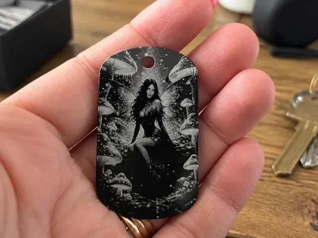Engraved on black cheap dogtag. Image i created