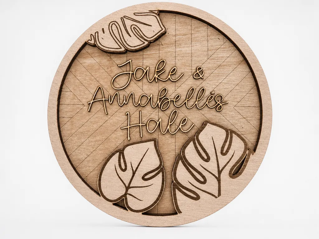 Personalized name/welcome sign decorated with monstera leaves
