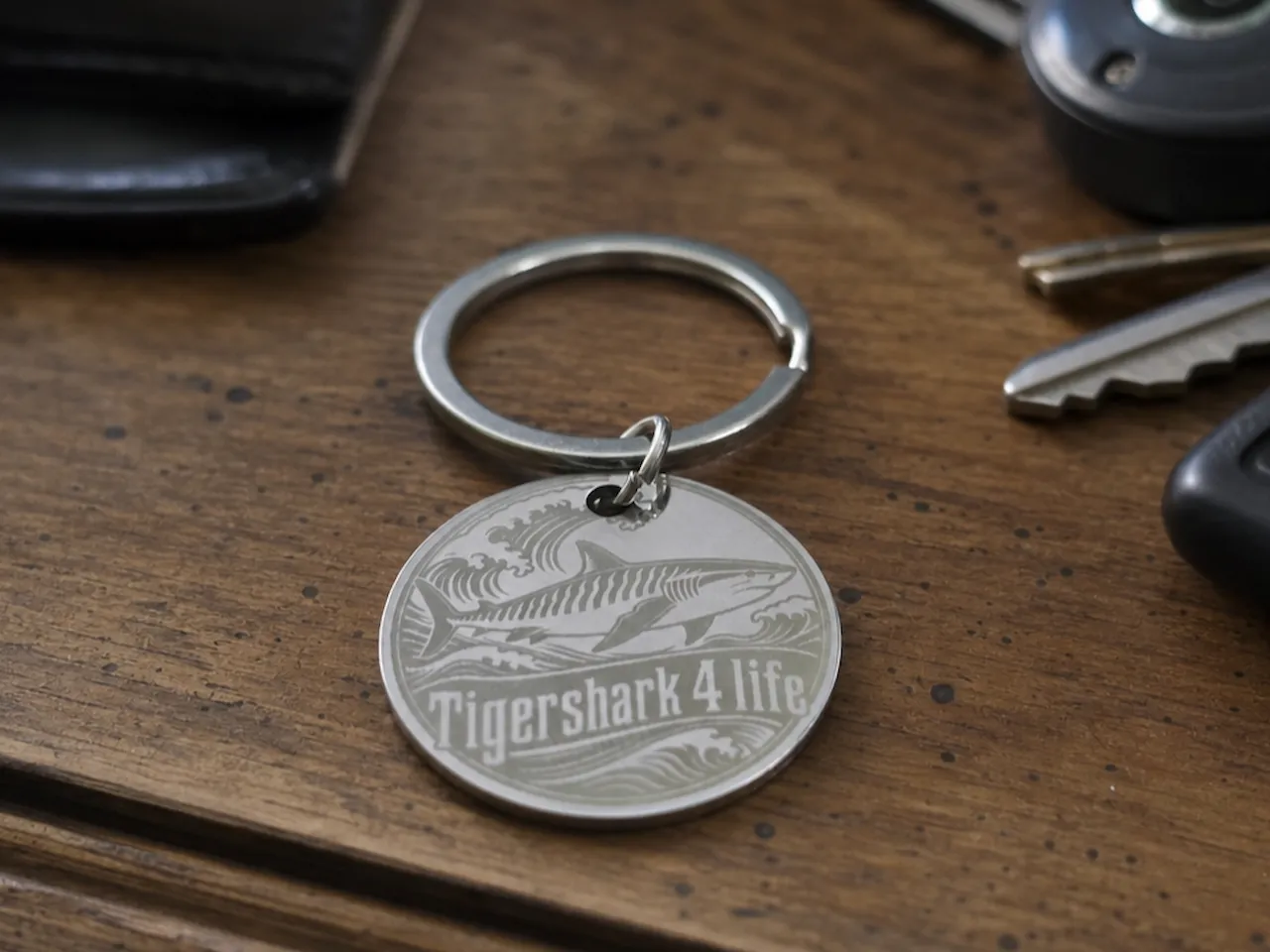 [Laser cut and engrave] Round metal keychain featuring a tiger shark and Tigershark 4 Life text