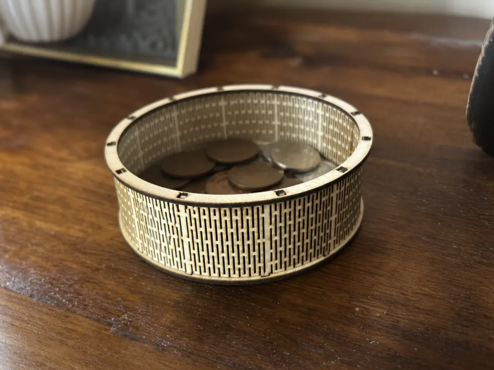 Round wooden coin tray with geometric lattice pattern
