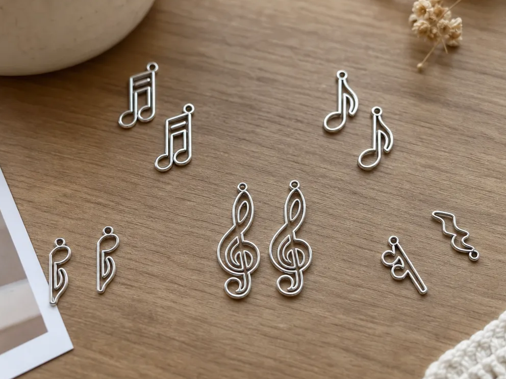 Silver metal musical note shaped pendant accessory