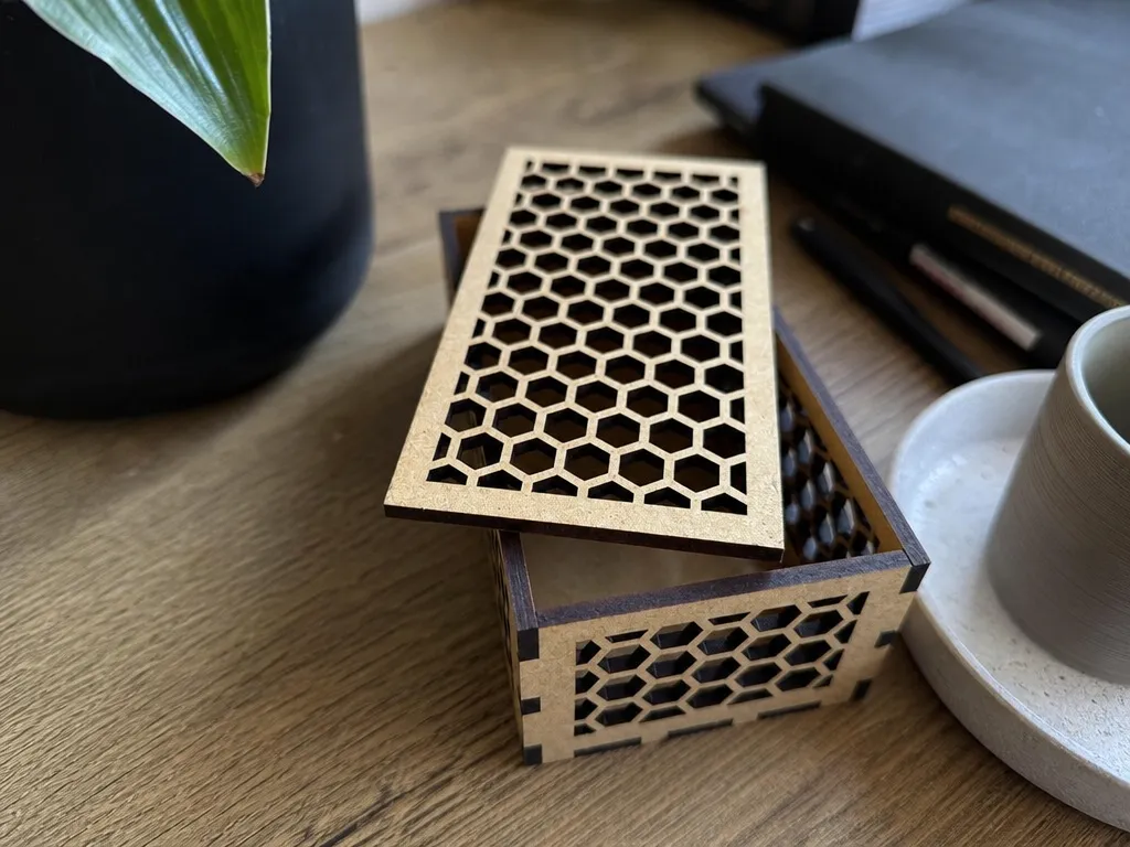 Rectangular wooden storage box with honeycomb pattern lid