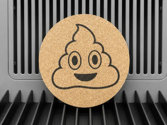 Round Cork Coaster with Smiling Poop Emoji Design
