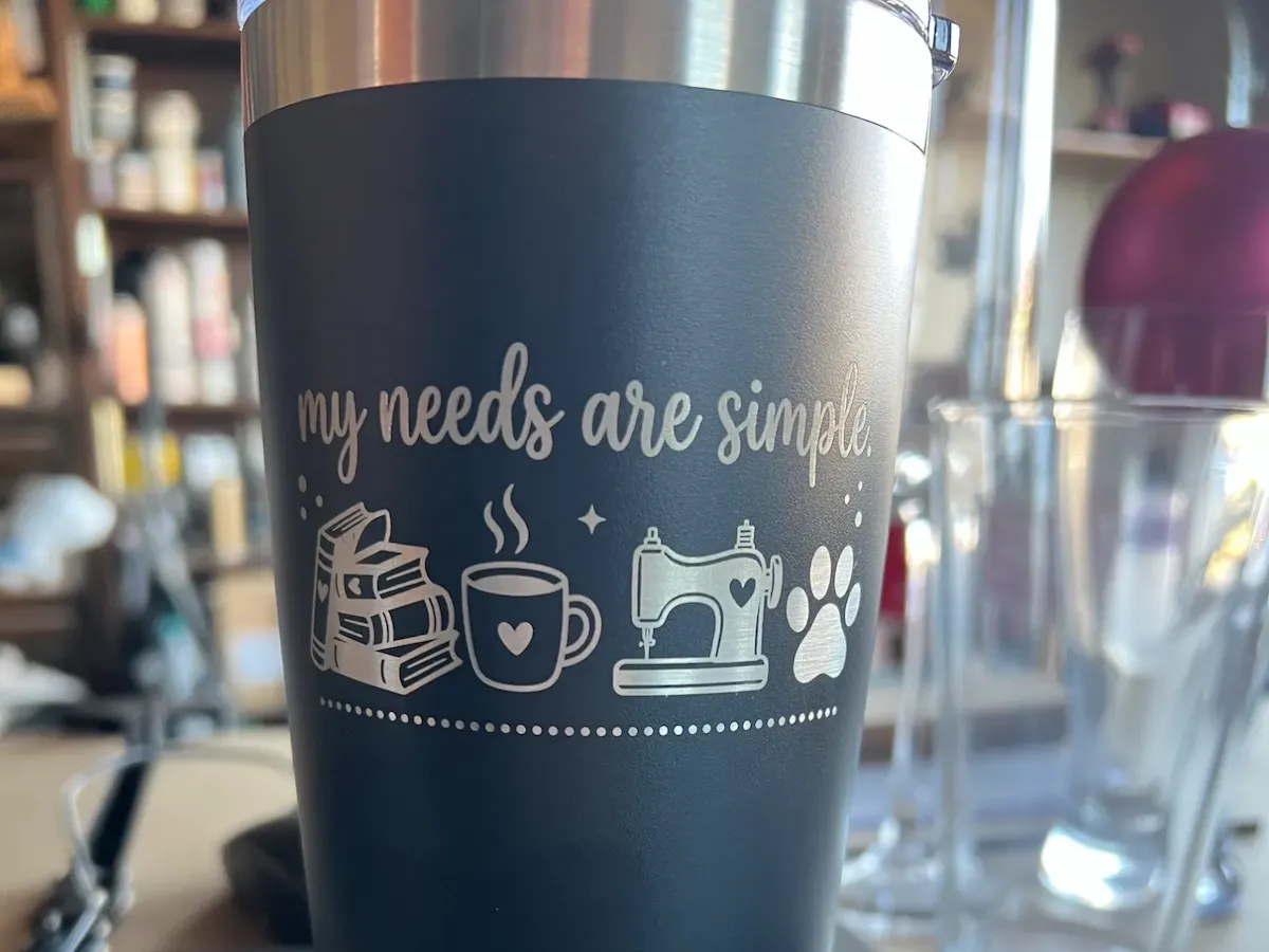 [Laser cut and engrave] My Needs Are Simple Tumbler with Book, Coffee, Sewing Machine, and Paw Print Icons
