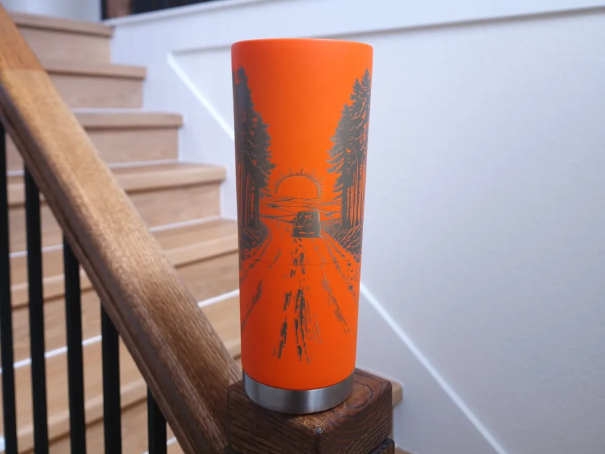Orange Insulated Tumbler Featuring Off-Road Vehicle and Forest Landscape