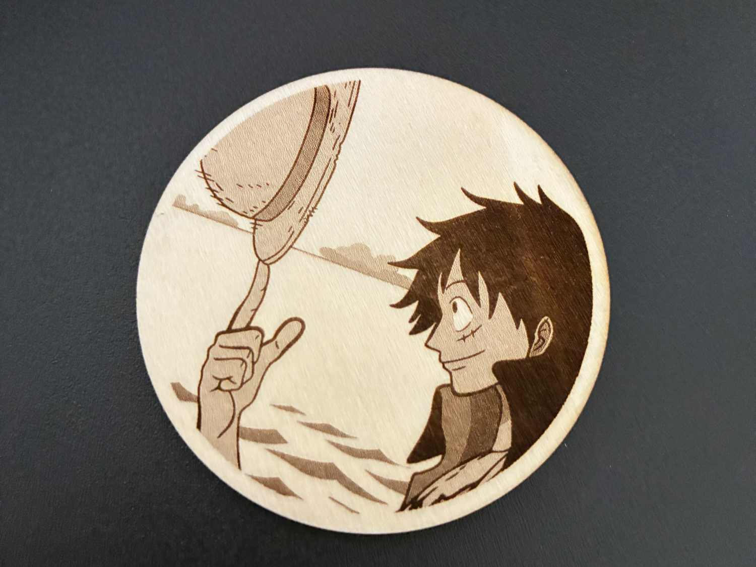 Monkey D Luffy One Piece character engraved on wooden coaster