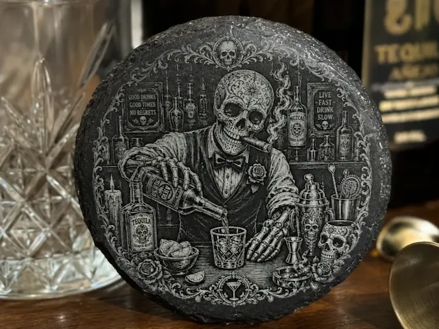 Round Slate Coaster Featuring a Skeleton Bartender Serving Tequila