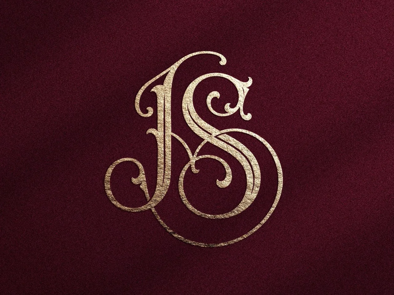 [Laser cut and engrave] Monogramme doré entrelacé avec les lettres JS sur fond texturé bordeaux