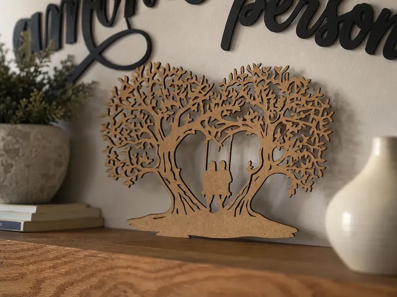 Heart-Shaped Tree Silhouette with Couple on a Swing